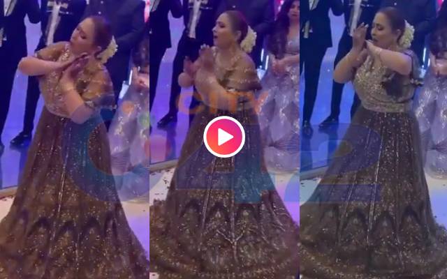 Mother dances at her daughter's wedding